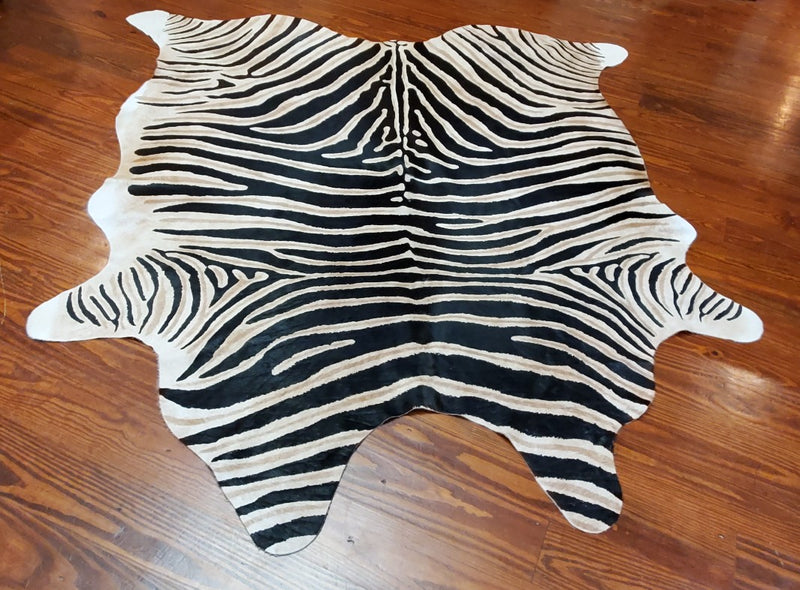 zebra print on cowhide floor rug